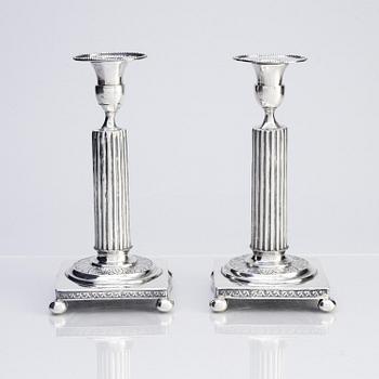 A pair of Gustavian silver candlesticks, unclear maker's mark, the cuffs with mark of Pehr Zethelius, Stockholm 1796.