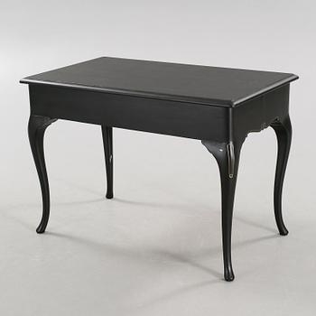 A 20th century desk in the style of rococo.