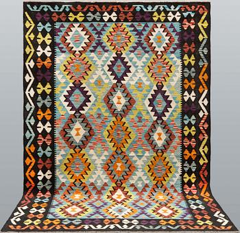 A kilim rug, c 256 x 176 cm.