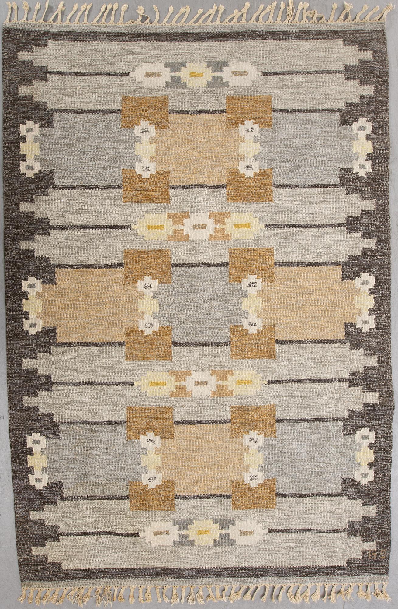 A signed flat weave carpet 220x160 cm.