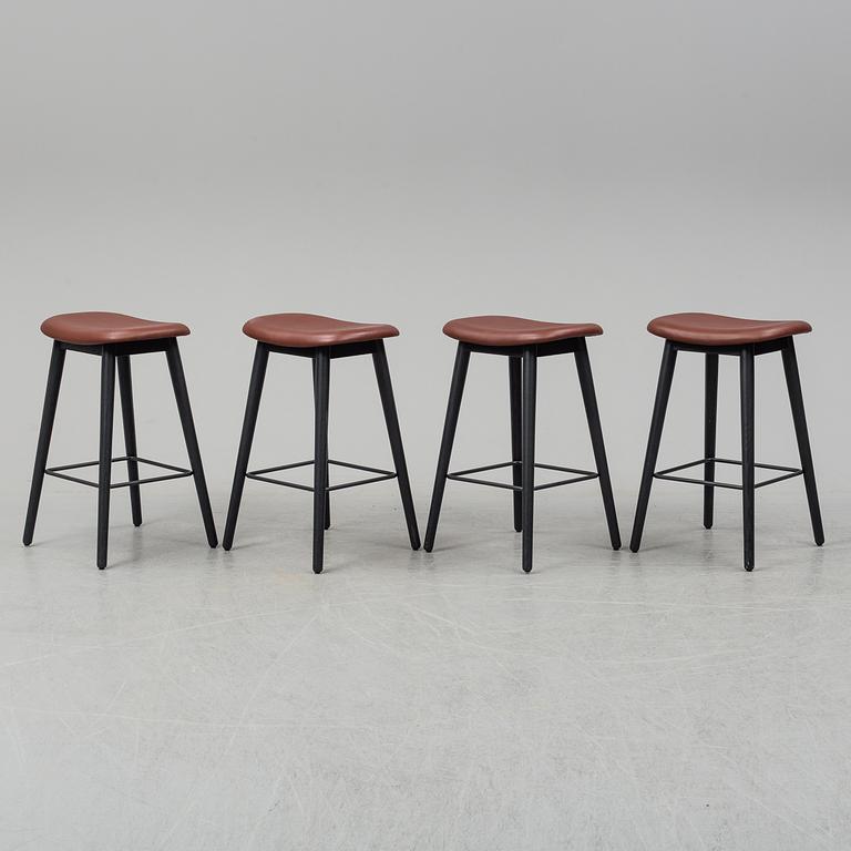 Four contemporary leather upholstred stools by Berlin & Iskos for Muuto.