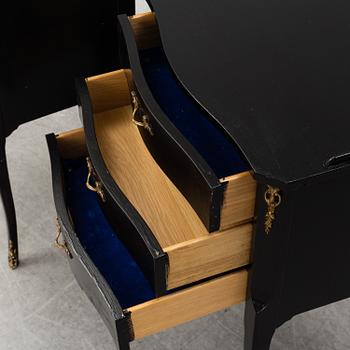 A second half of the 20th Century rococo style pair of bedside drawers.