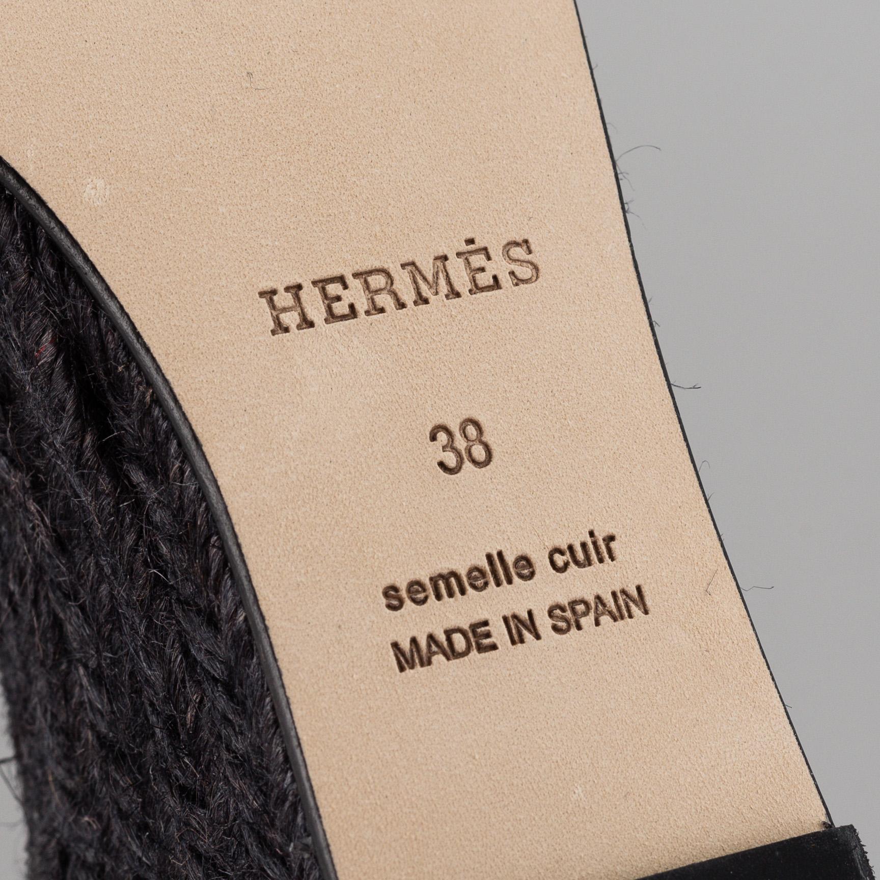 HERMÈS, a pair of black leather 'Tivoli' wedge sandals, 2019, size 38.