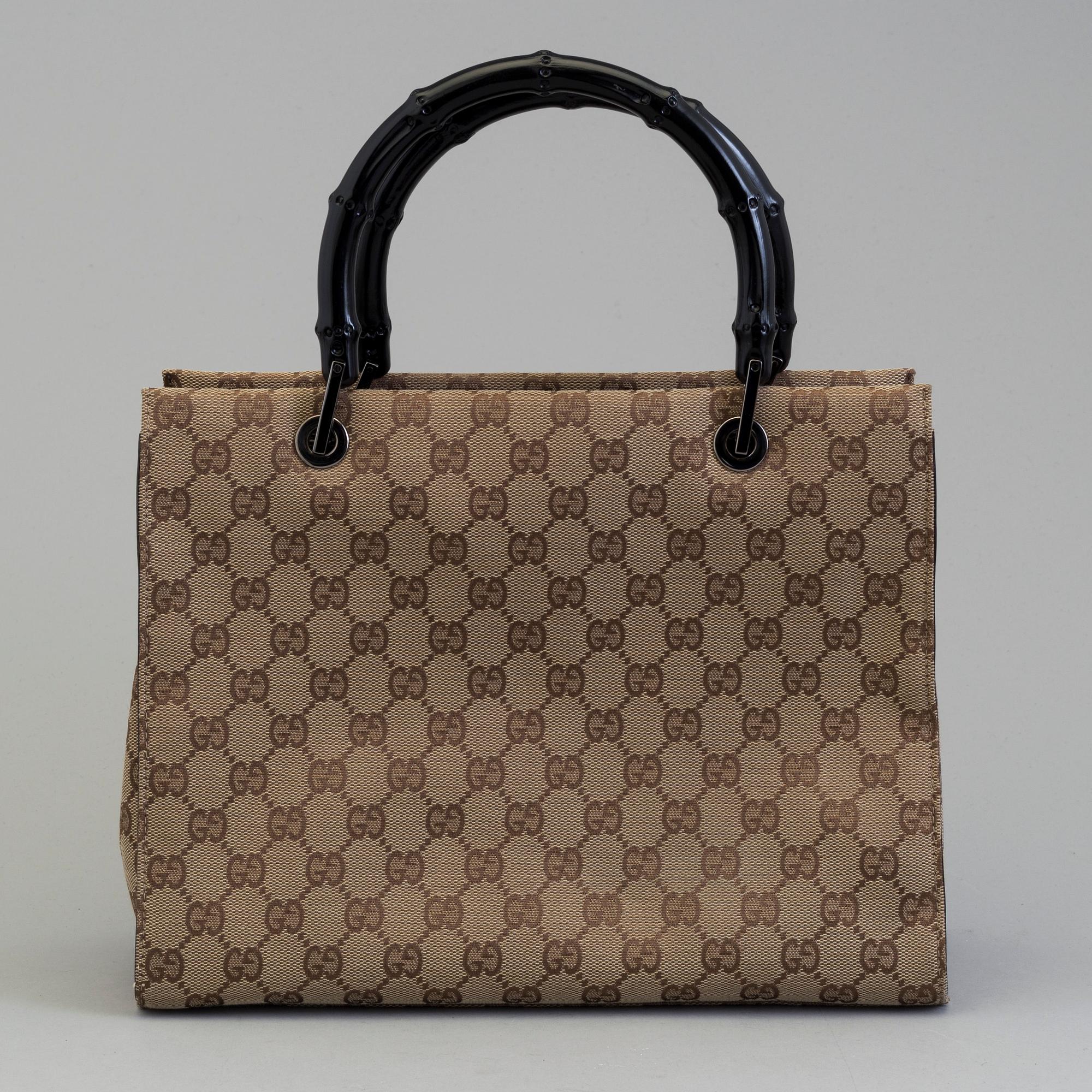 GUCCI, a monogram fabric hand bag and beauty bag.