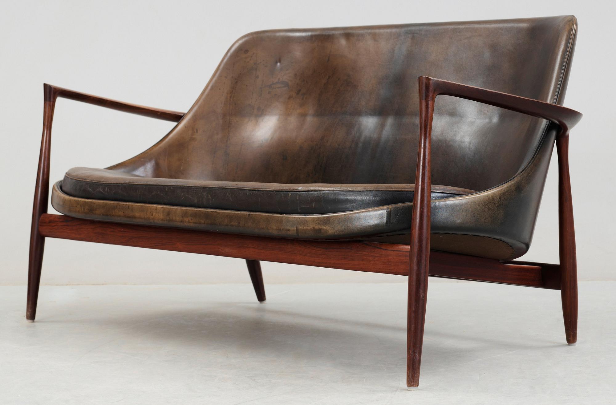 An Ib Kofod Larsen 'Elisabeth' palisander and black leather sofa, Christensen & Larsen, Denmark 1950-60's.
