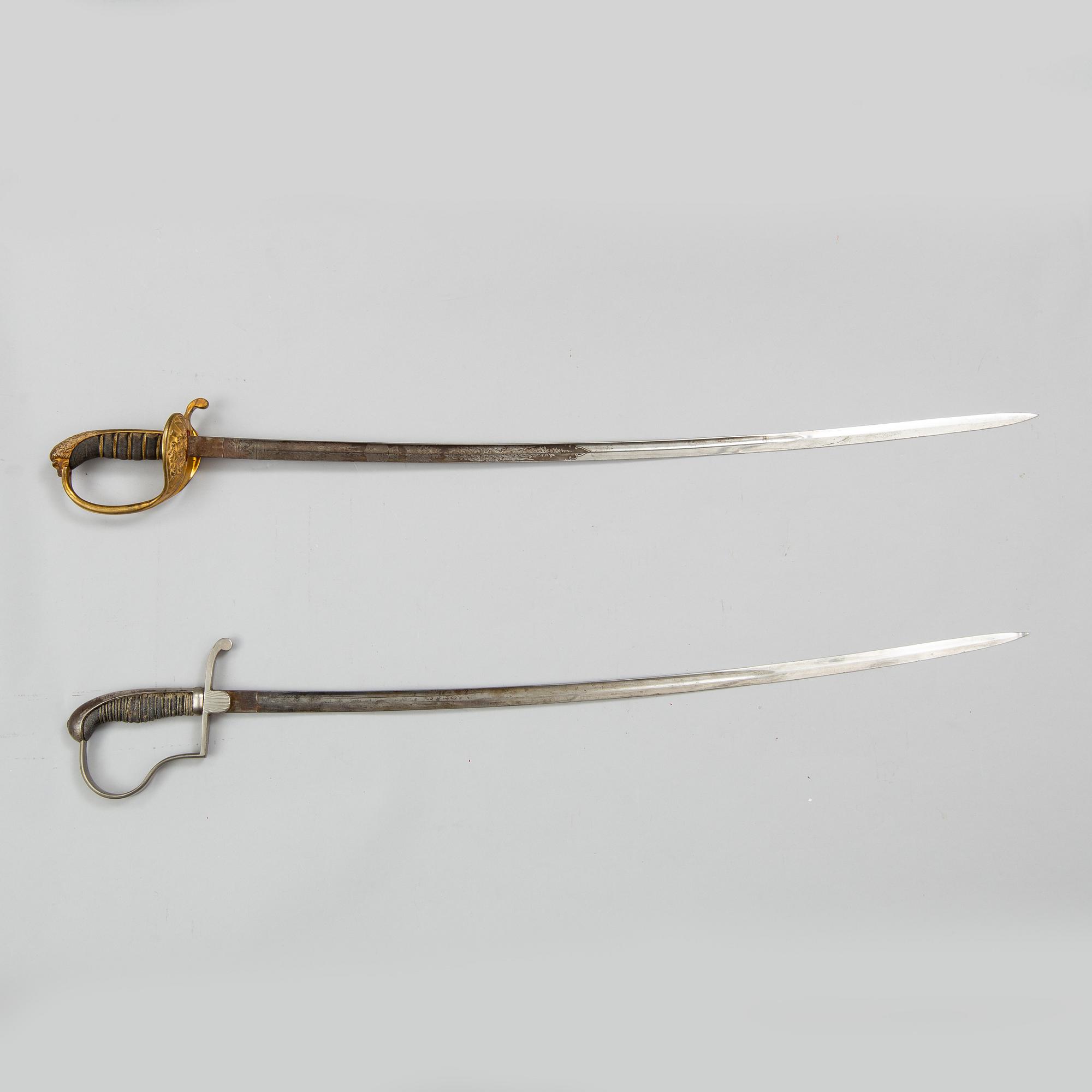 Two Swedish sabres, end of the 19th Century, with scabbards.