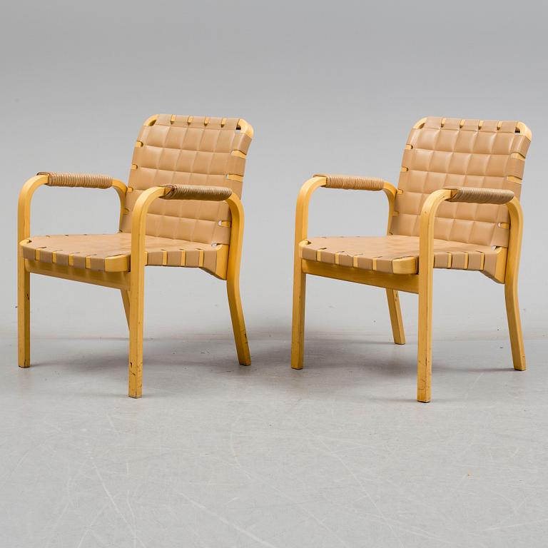 ALVAR AALTO, a pair of mode 45 leather upholstered birch armchairs from Artek, Finland.