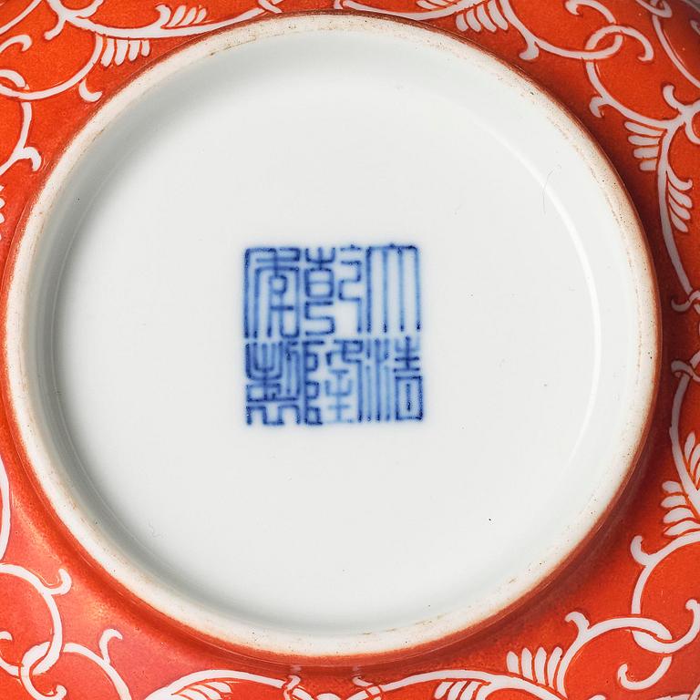A coral red reserve decorated floral bowl, Qing dynasty with Qianlong mark.