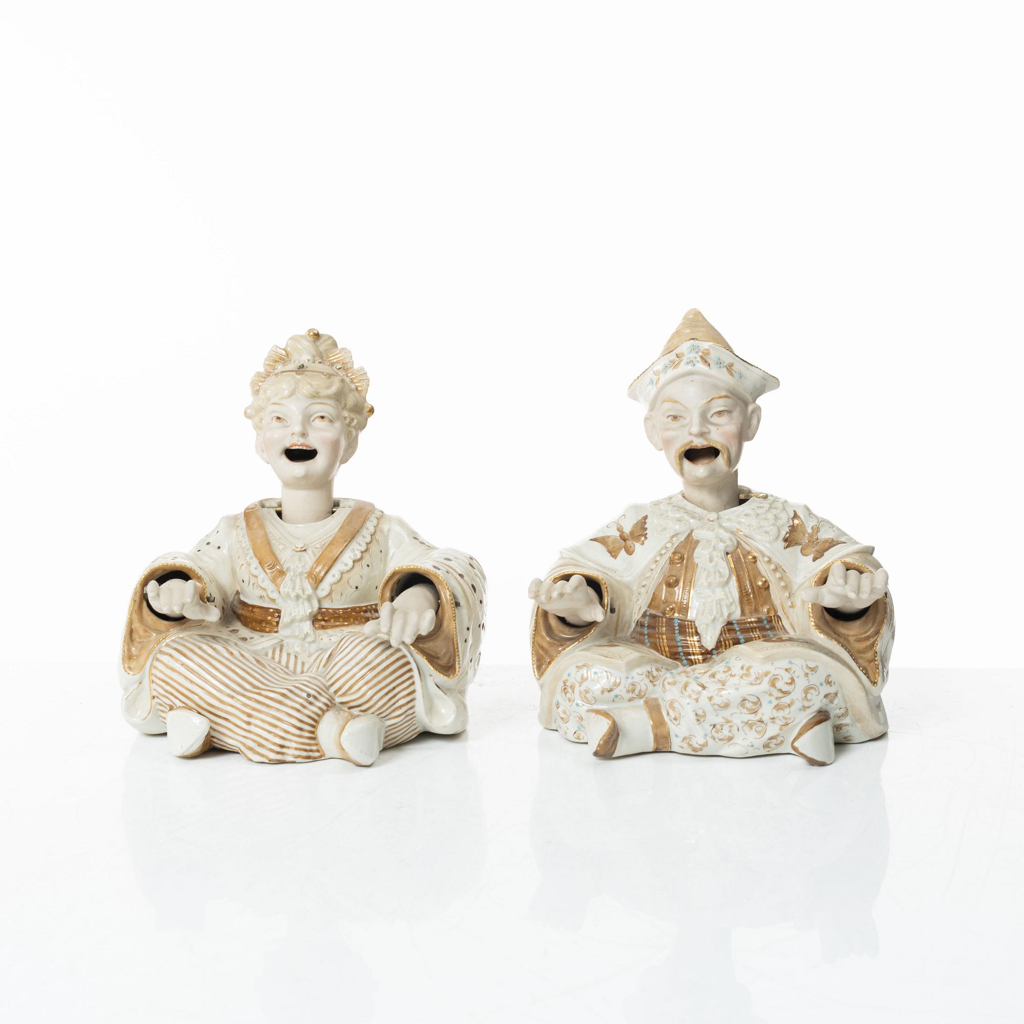 A pair of porcelain nodding head figures, Germany, 1920/30s.