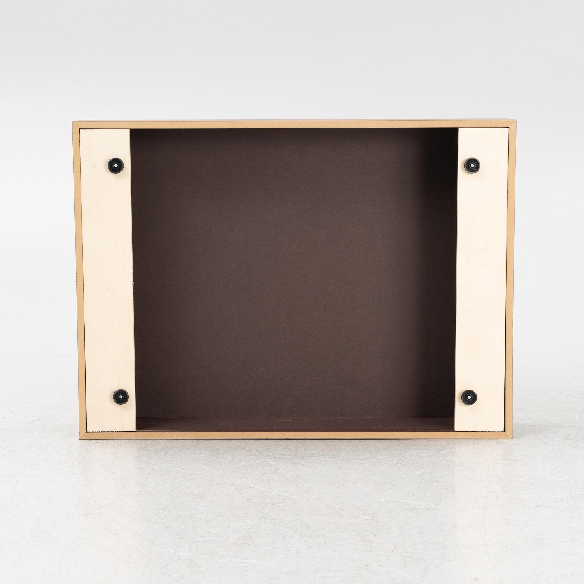 A 'Mass Wide' walnut veneered coffee table from New Works.