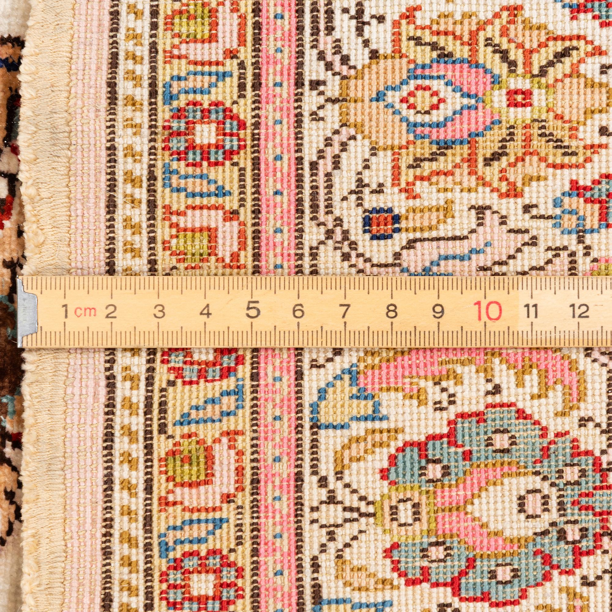 An Oriental silk rug, c. 122 x 76 cm.