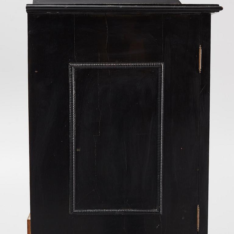 A South-German Baroque ebonized collector's cabinet on stand, circa 1700.