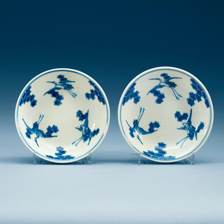 A pair of Japanese blue and white crane dishes, presumably 19th Century.