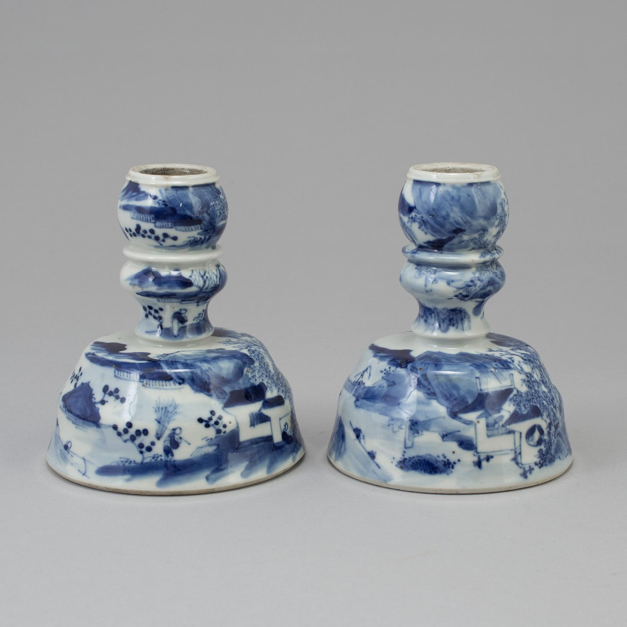 A pair of blue and white candlesticks, late Qingdynasty.