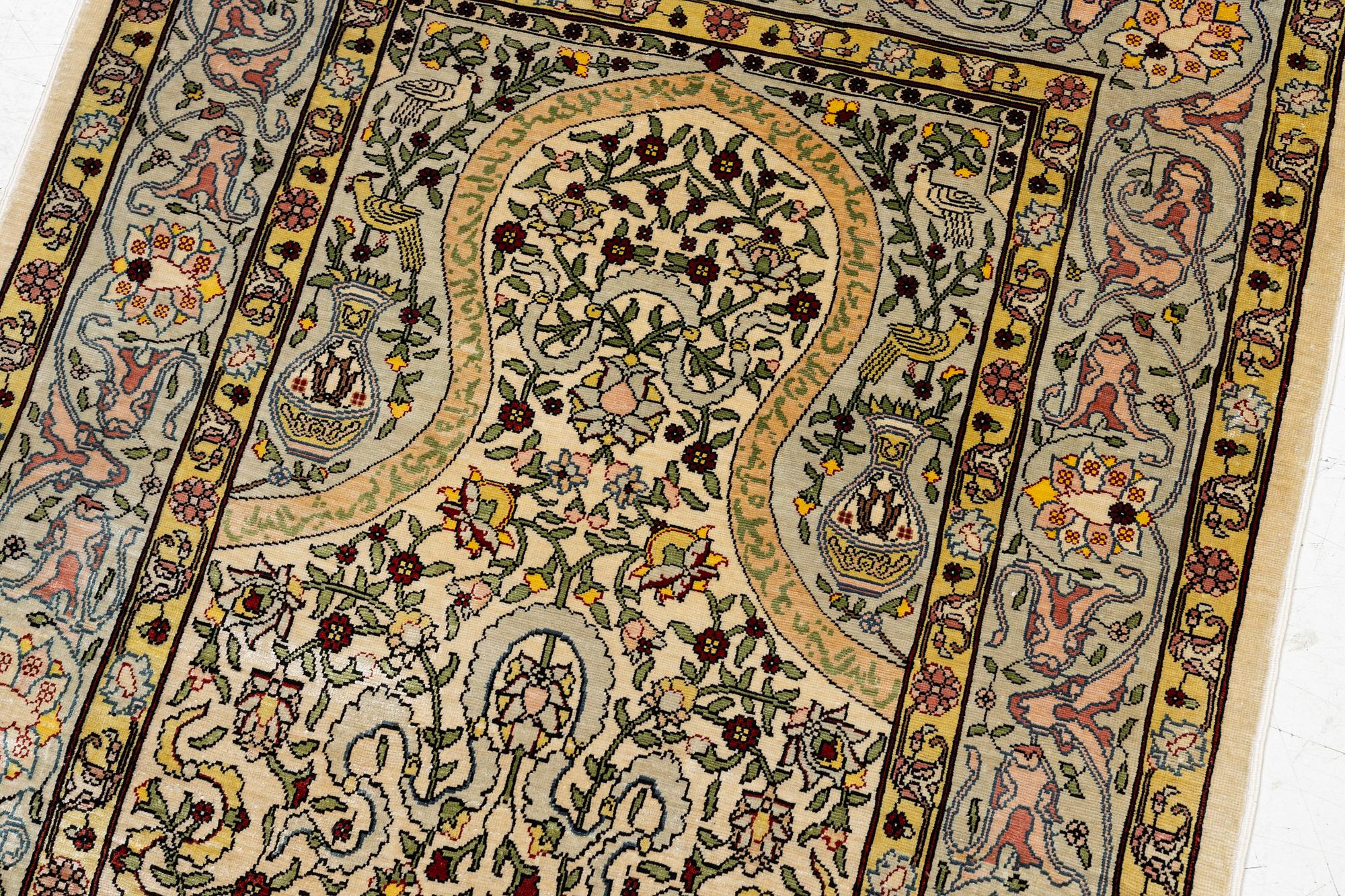 A silk Hereke rug, Turkey, approx. 82 x 58 cm.