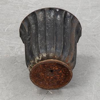 A cast iron garden urn, 20th Century.