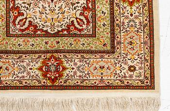 A Hereke silk rug, West Anatolia, c. 107 x 69 cm.