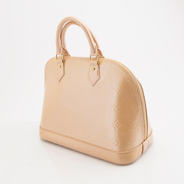 Louis Vuitton, an "Alma PM" handbag.