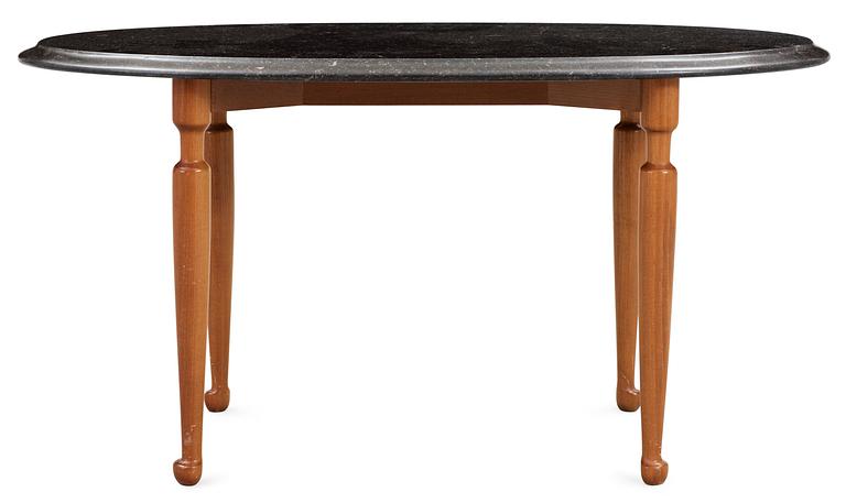 A Josef Frank black marble top and mahogany table by Svenskt Tenn.