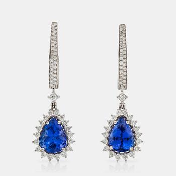 1272. A pair of tanzanite and brilliant-cut diamond earrings. Tanzanites total carat weight 9.10 cts, diamond weight 2.10 cts.