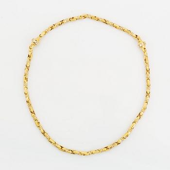 An 18K gold necklace/bracelet combination.