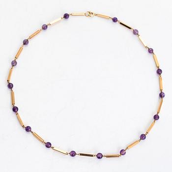 An 18K gold necklace, consisting of gold bars and amethyst beads.