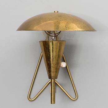 A mid-20th century wall light / table lamp, model EV 57 for Itsu, Finland.