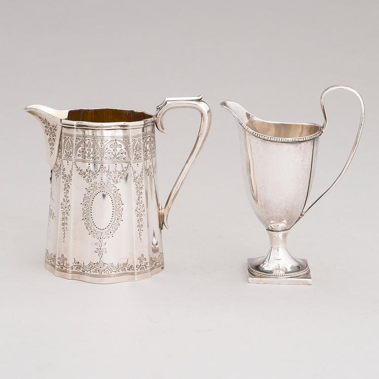 Two sterling silver milk jugs, mark of Thomas Hyde 1783 and Walter & John Barnard 1877, London.