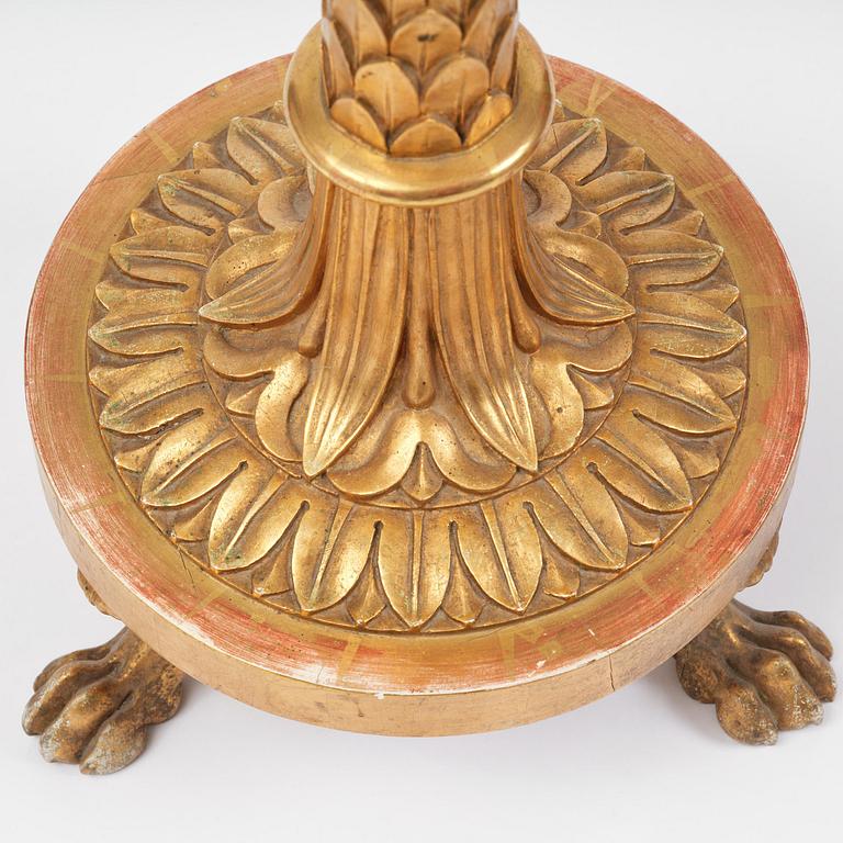 A pair of late Gustavian giltwood torchères by J. Frisk (master in Stockholm 1805-24).