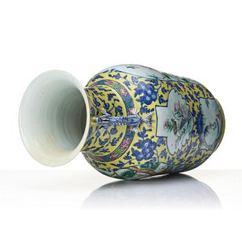 A famille rose yellow ground vase, late Qing dynasty.