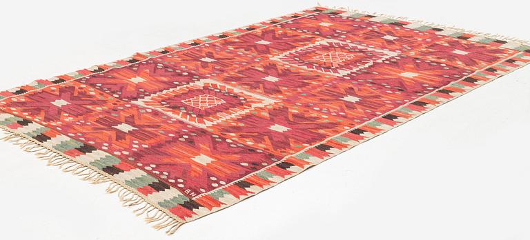 Barbro Nilsson, a carpet, 'Nejlikan röd', tapestry weave, c 331 x 214 cm, signed AB MMF BN.