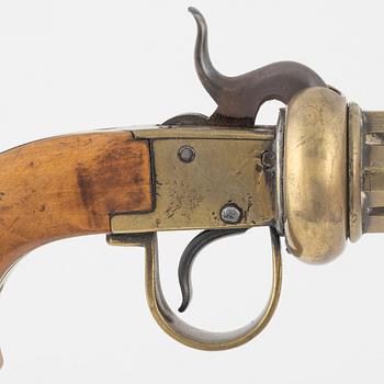 A brass percussion revolver by Johan Engholm (1820-1918).