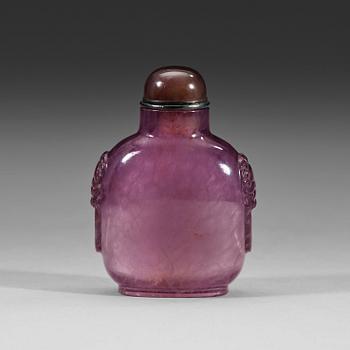 50. An amethyst snuff bottle with stopper, Qing dynasty (1644-1912).