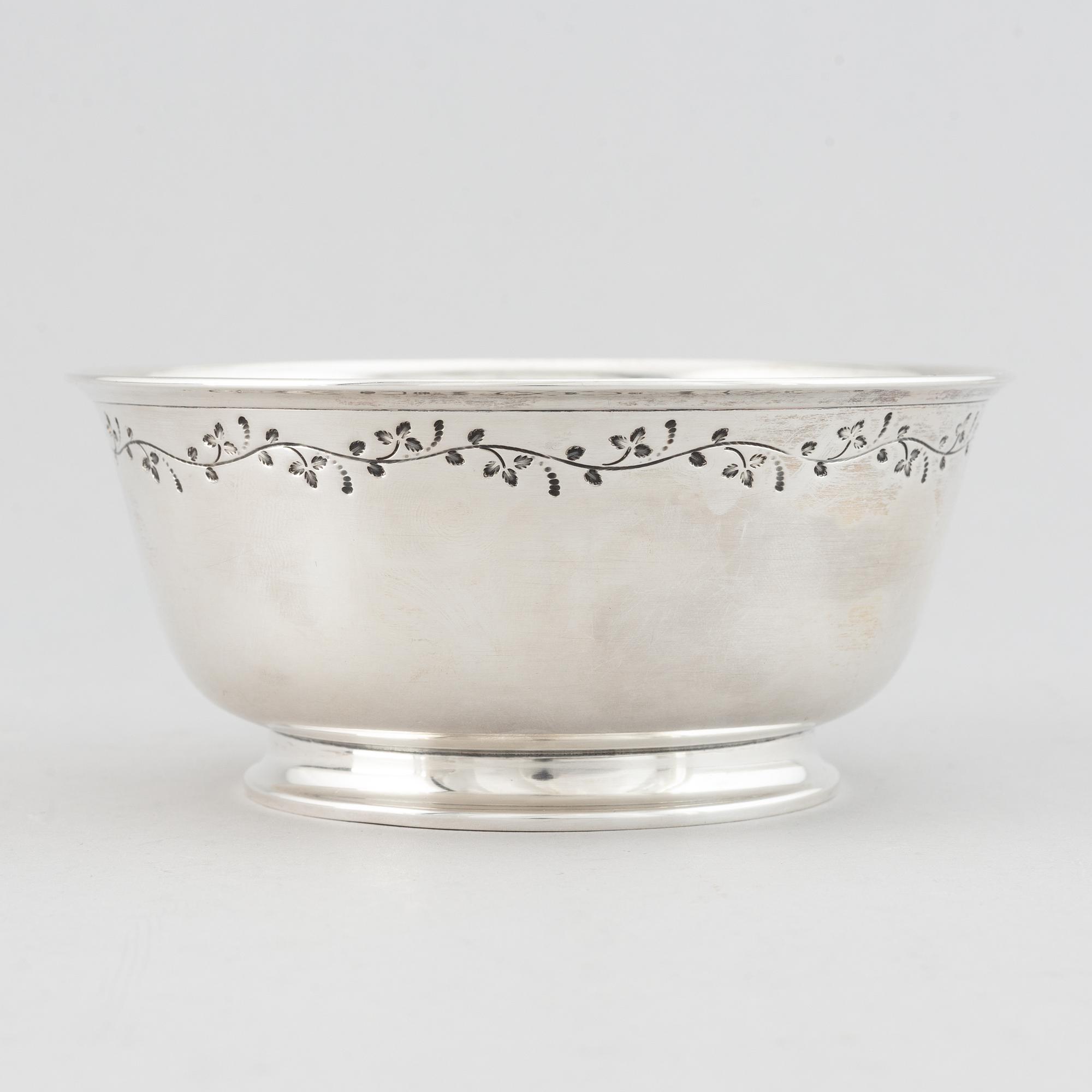 Tore Eldh, a silver bowl, decorated with a border of leafy sprigs, Gothengurg, Sweden, 1950.