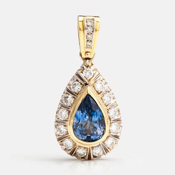 An 18K gold penadant with brilliant cut diamonds ca. 1.45 ct in total and a sapphire.