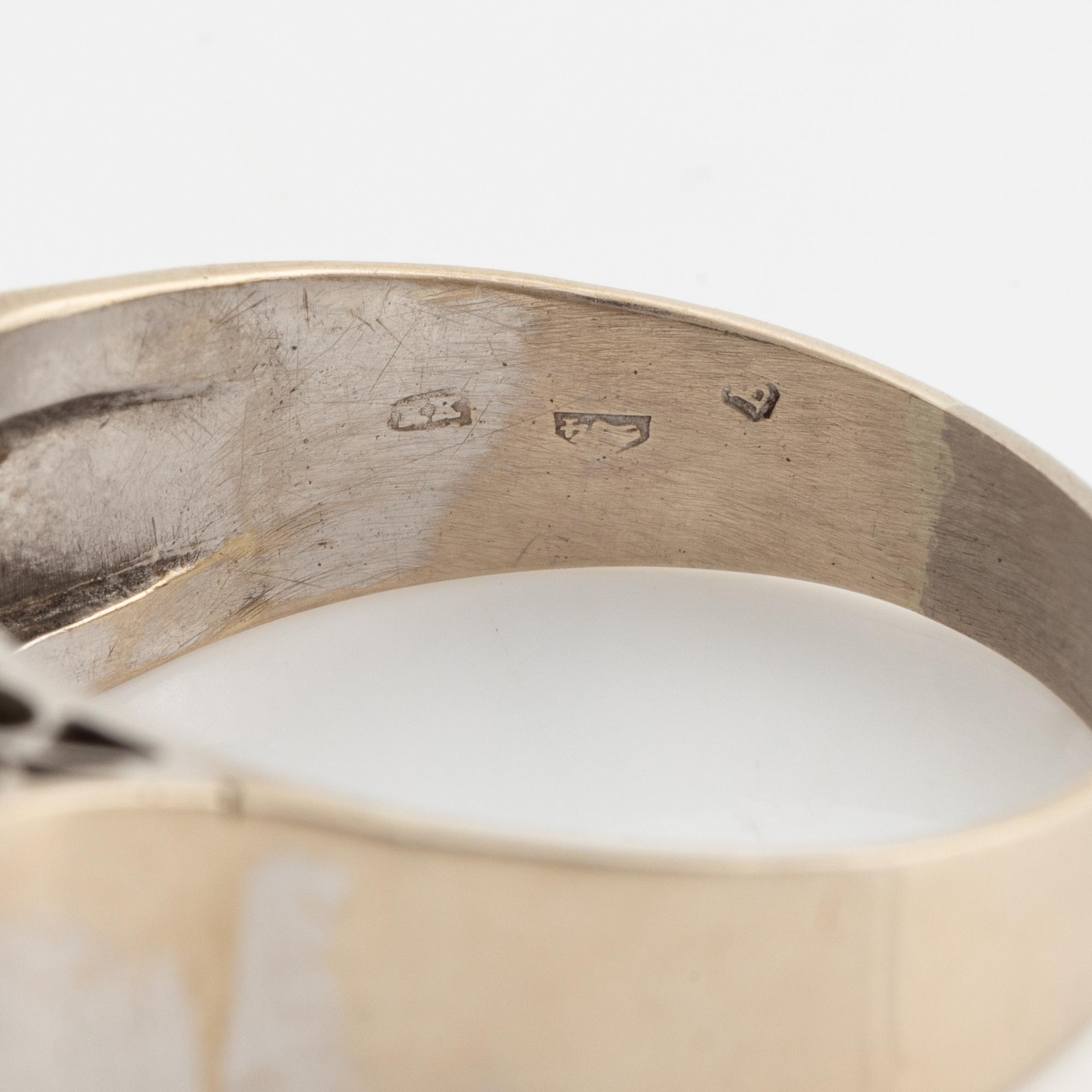 A 14K gold ring set with old-cut diamonds.