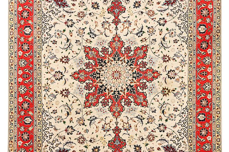 A Tabriz, part silk carpet, c. 300 x 199 cm.