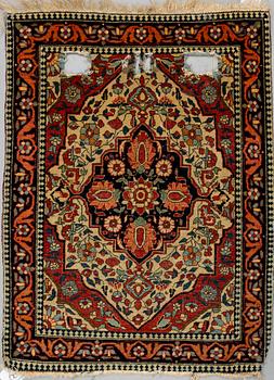 A RUG, a semi-antique Kashan Motachem, ca 84 x 64 cm.