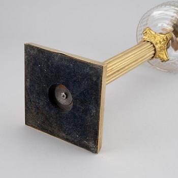A brass oil lamp, ca 1900.