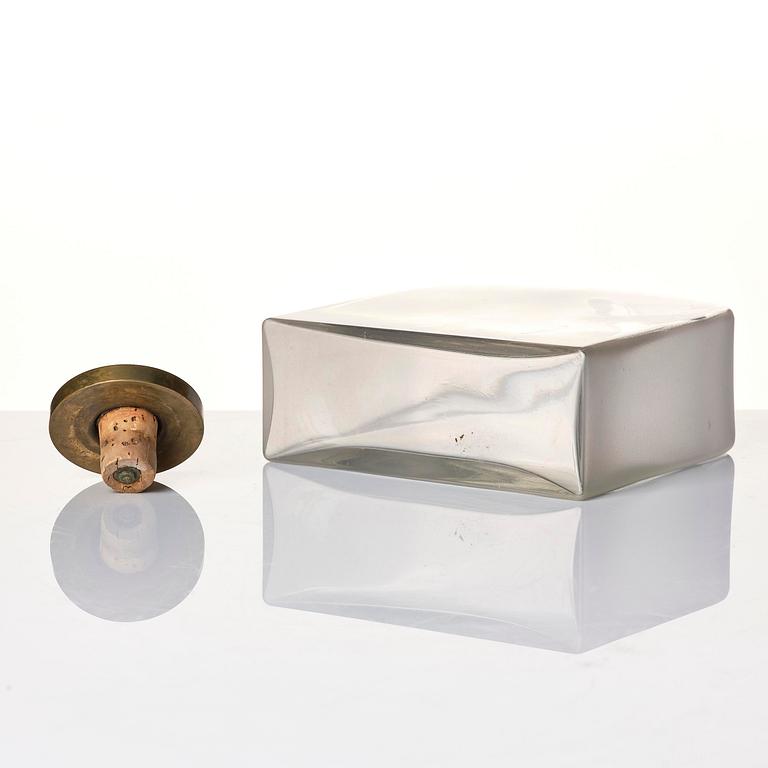 Firma Svenskt Tenn, a glass bottle model A 1608, with a pewter and brass stopper by Björn Trägårdh, Stockholm, 1930s.