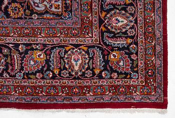 An Oriental carpet, approx. 380 x 304 cm.