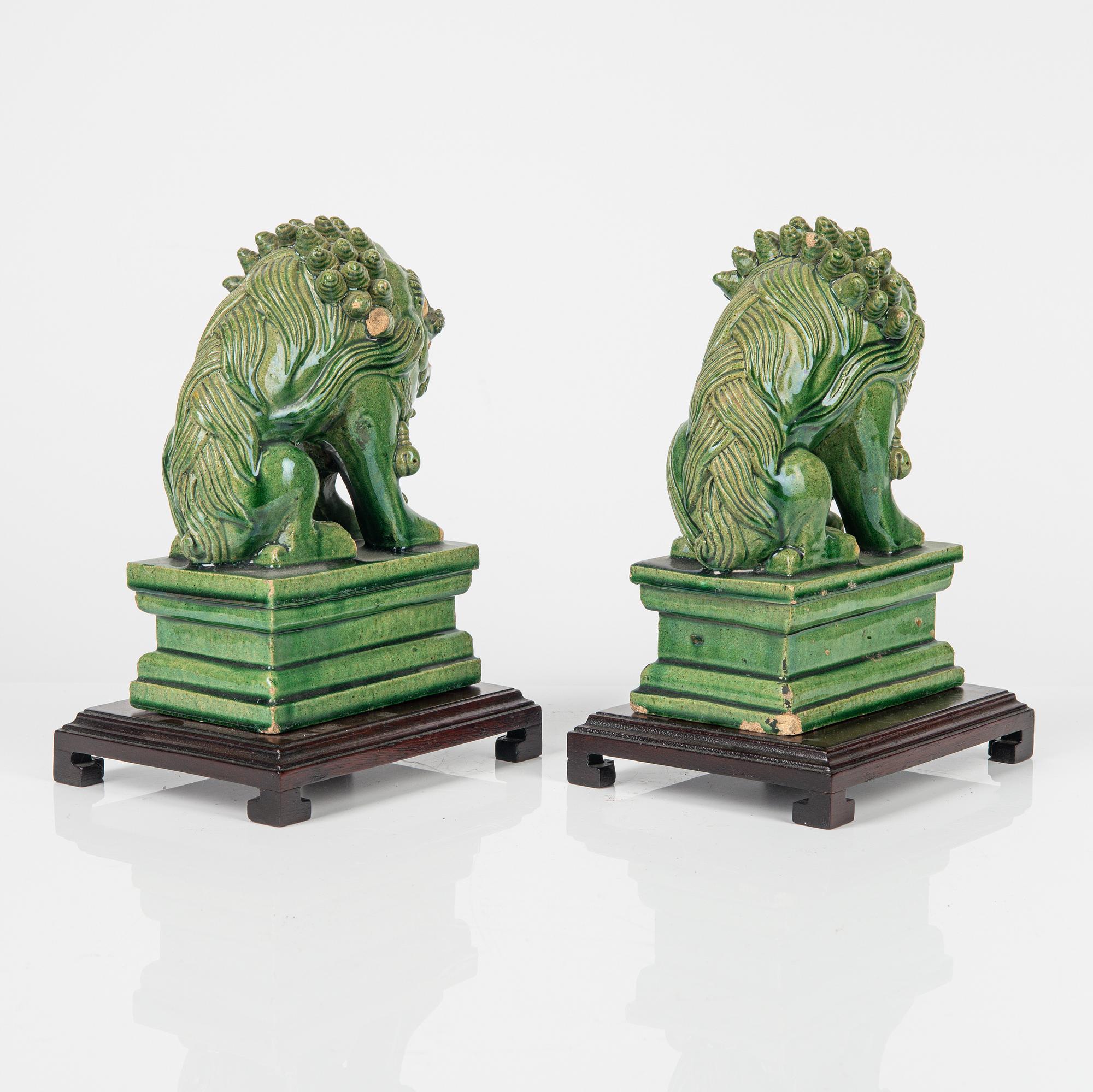 A pair of green glazed figures of mythical beasts, Ming style, China, 20th Century.