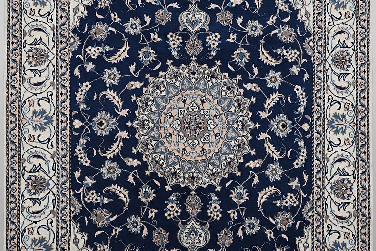 A carpet, Nain, part silk, ca 294 x 198 cm.