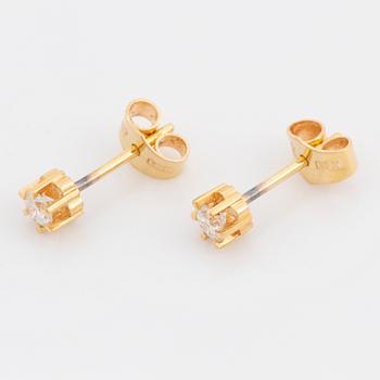 Brilliant cut diamond stud earrings.