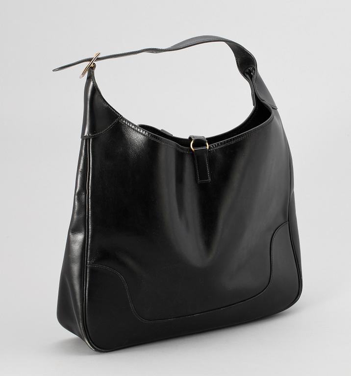 A 1970s black leather handbag by Hermès, model "Trim bag".
