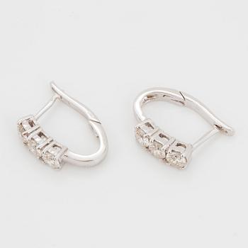 Brilliant-cut diamond earrings.