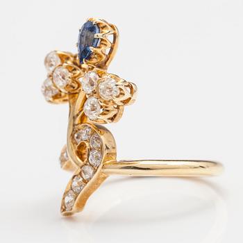 A 14K gold ring with sapphires and ca. 0.78 ct of old cut diamonds and a rose cut diamond. Turn of the 20th century.