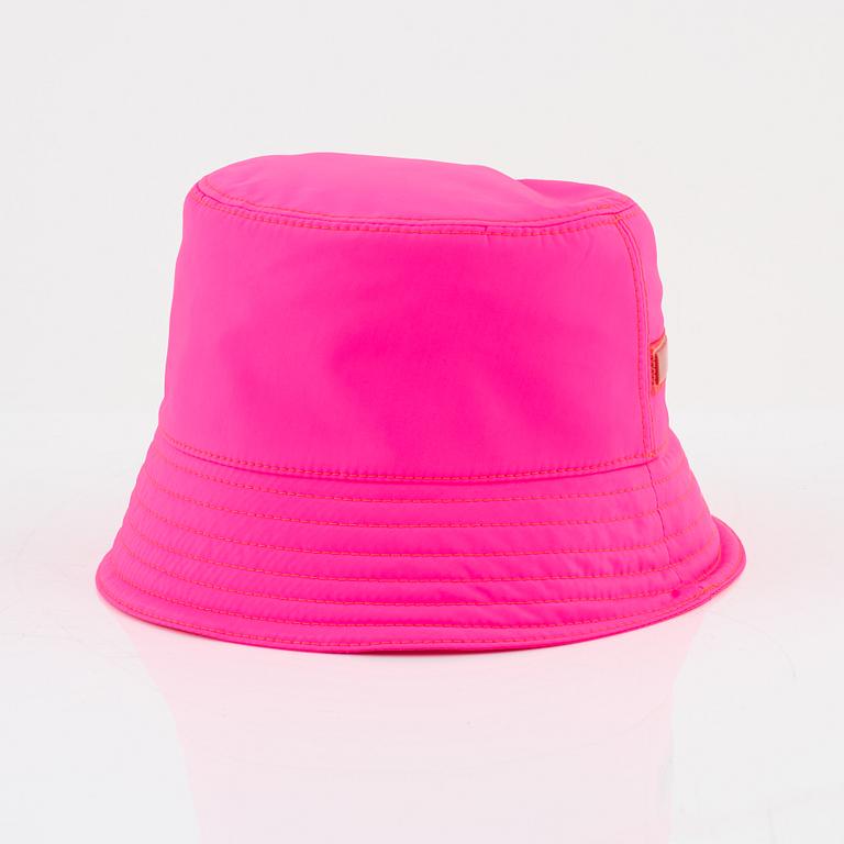 Prada, a neon pink bucket hat.