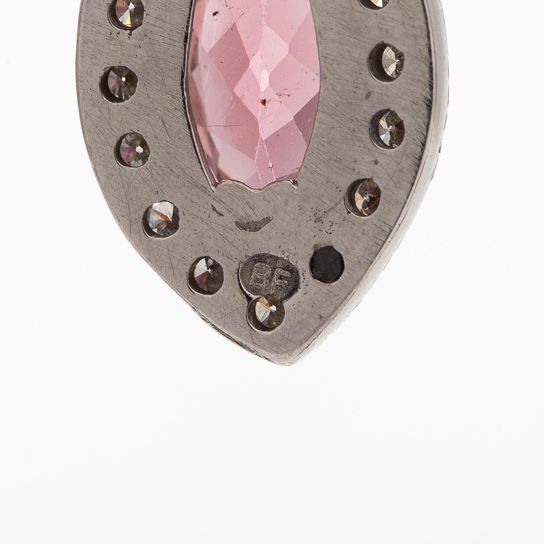 A pair of 14K white gold earrings, set with brilliant-cut diamonds and pink tourmalines.