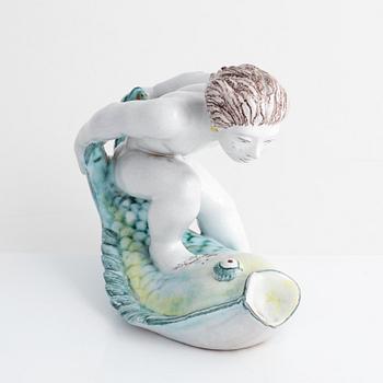 Tyra Lundgren, a faience figurine, Rörstrand, dated -30.